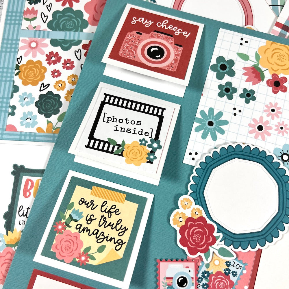 12x12 scrapbook page layouts with flowers and a camera