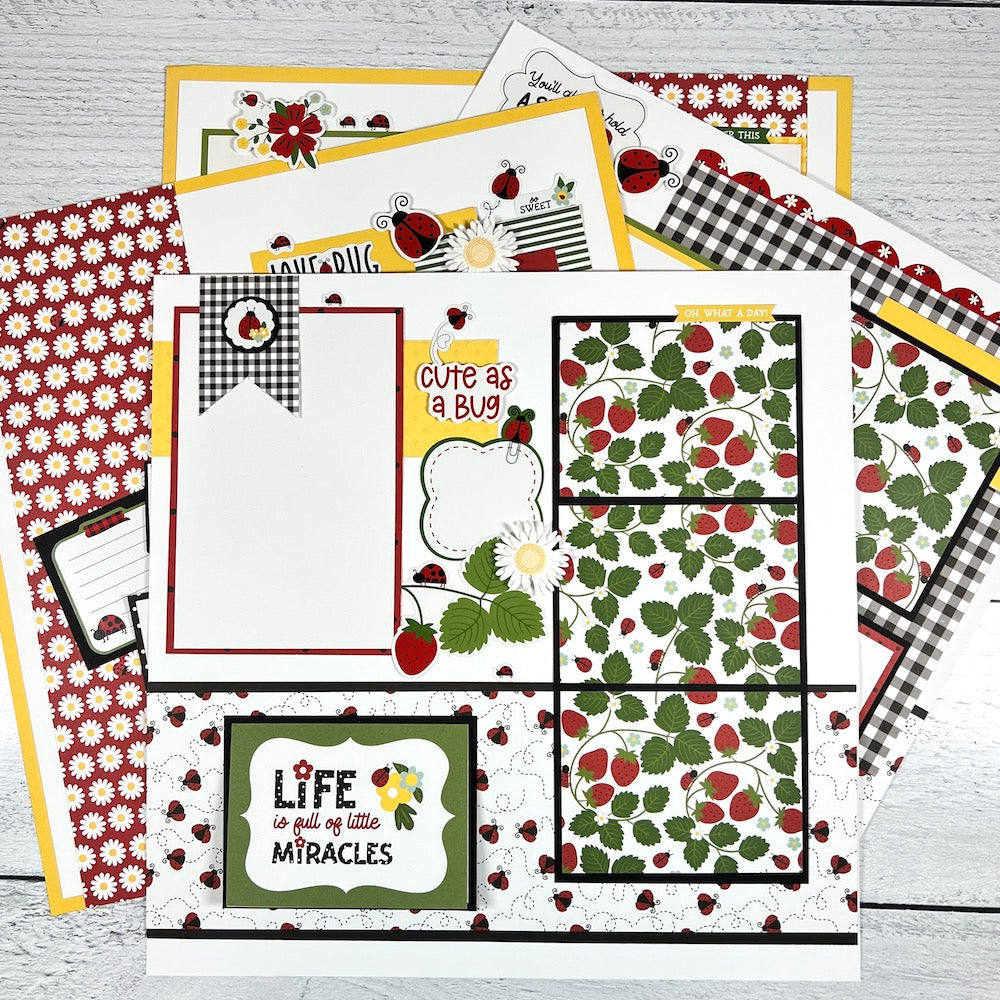 12x12 scrapbook layouts with strawberries, ladybugs, and daisies