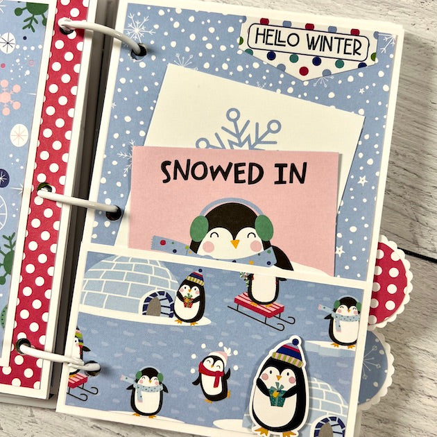 Winter Scrapbook Album page with snow, igloos, penguins, and a pocket