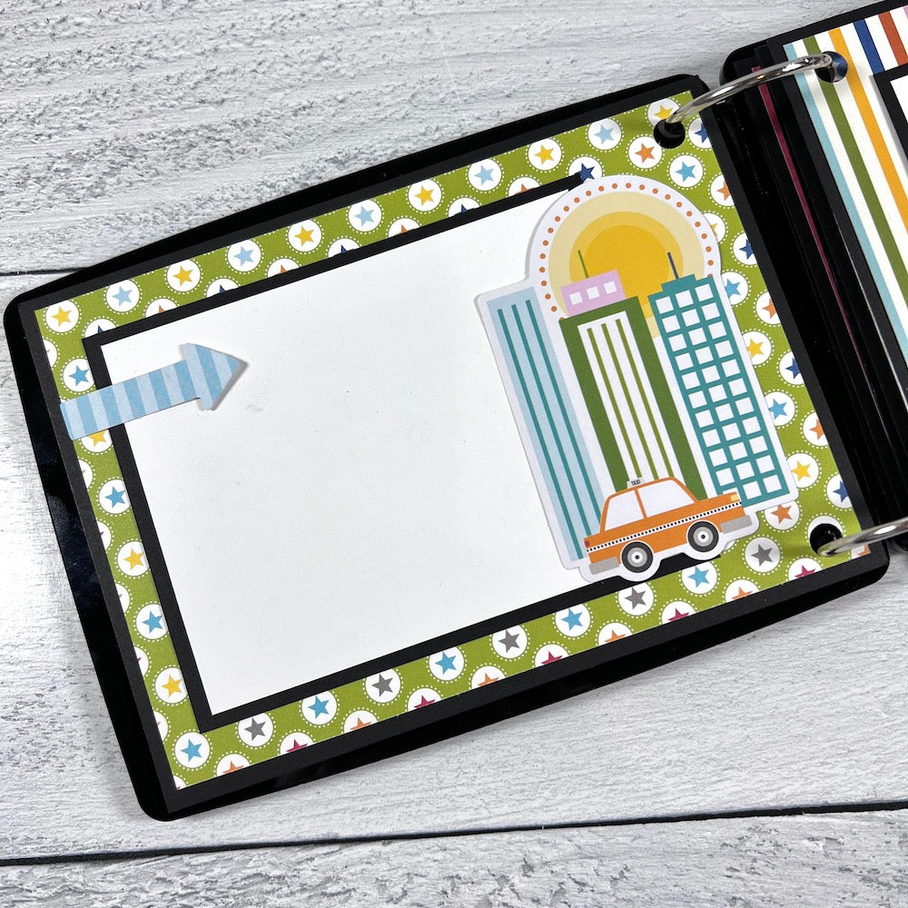 Travel Suitcase Shaped Scrapbook Album page with stars, a city scene, and a taxi cab
