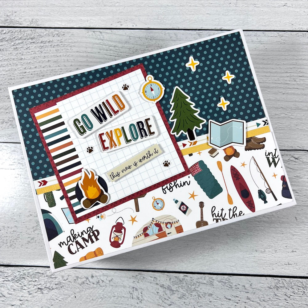 Outdoor Adventure Scrapbook Mini Album with camping supplies, trees, and stars