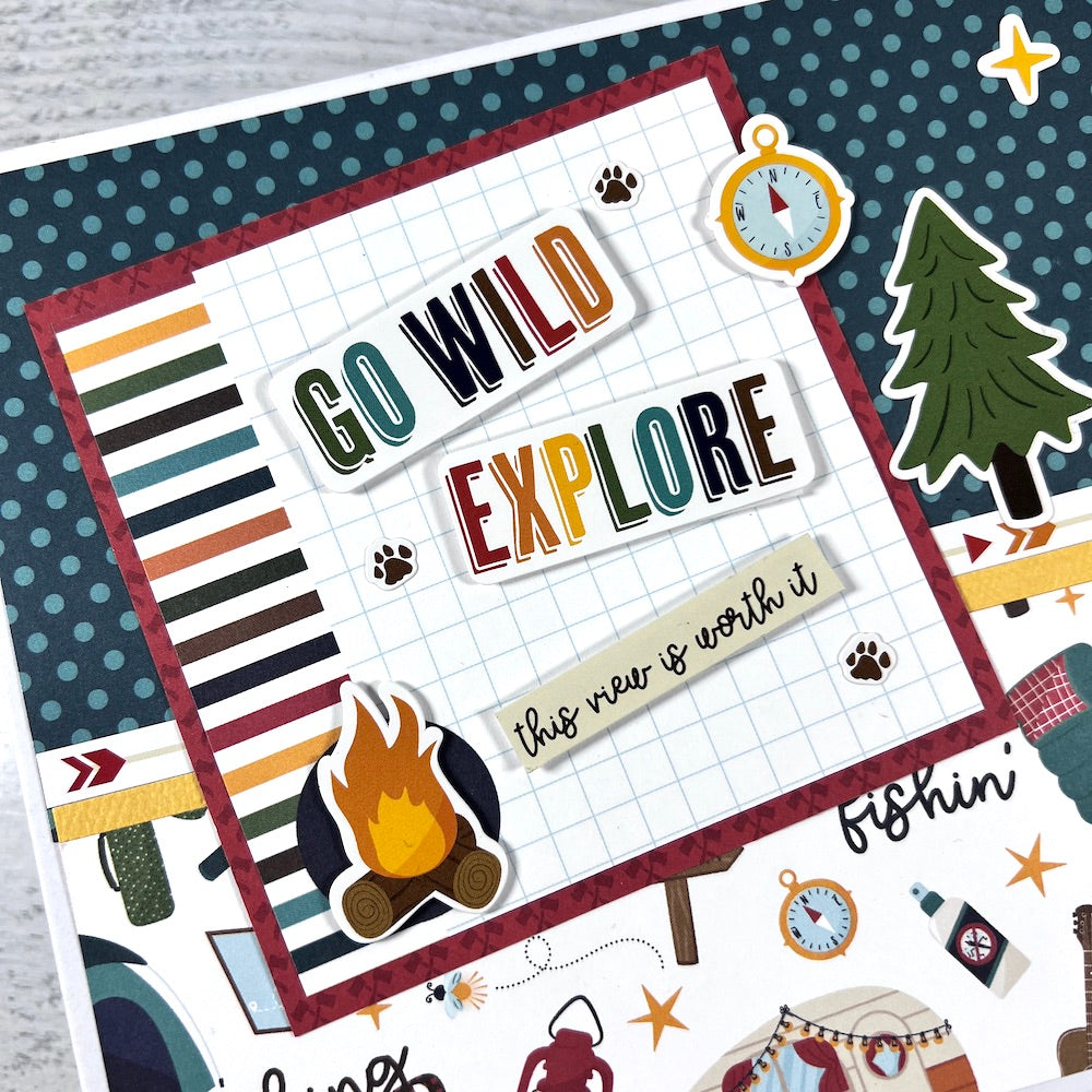 Go Wild Explore Scrapbook Mini Album with camping supplies, trees, and stars