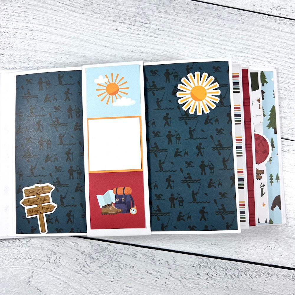 Outdoor Adventure Scrapbook Album with gate-fold pages, a sun, and a backpack