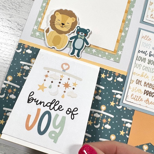 12x12 Baby Boy Scrapbook Page Layout with a lion, a bear, and a folding card
