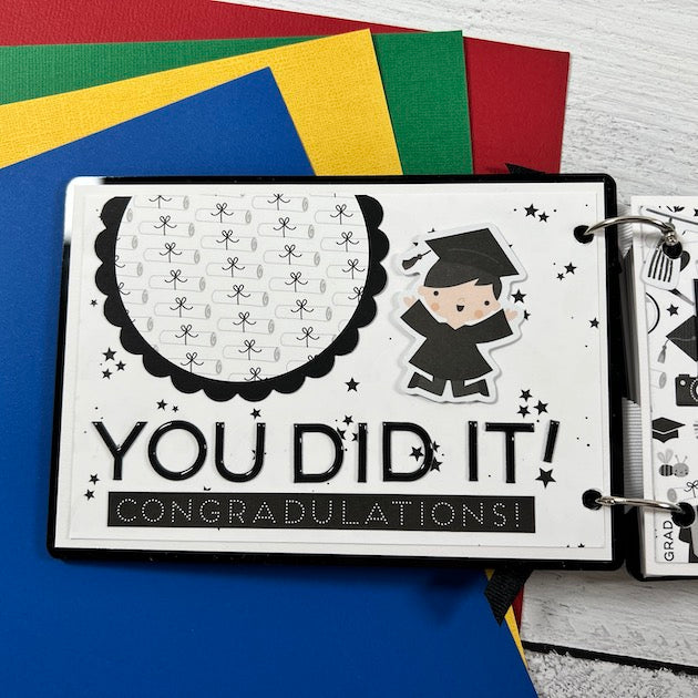 Graduation Scrapbook Album page with a student wearing a cap and gown and lots of diplomas