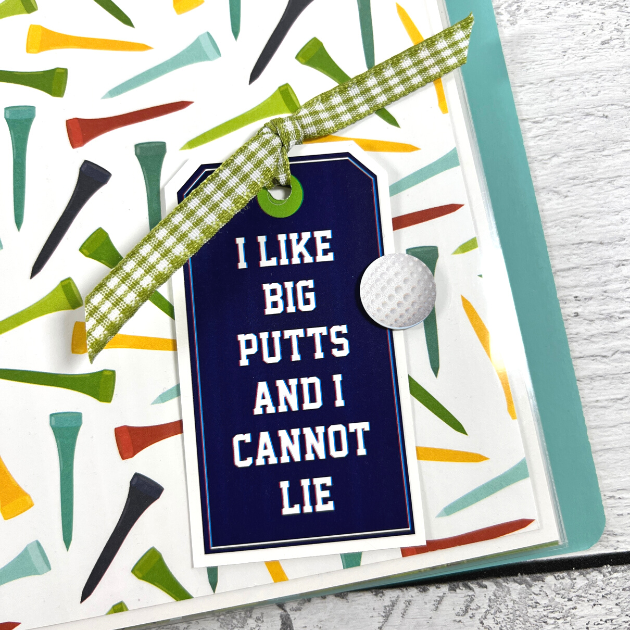 Golfing Scrapbook Album Page with golf ball, tees, and a tag with ribbon