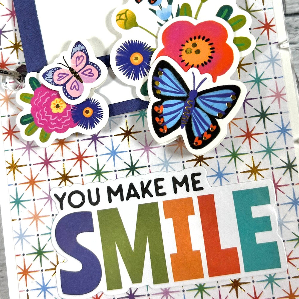 You Make Me Smile Scrapbook Mini Album with butterflies, flowers, stars, and gold foil accents