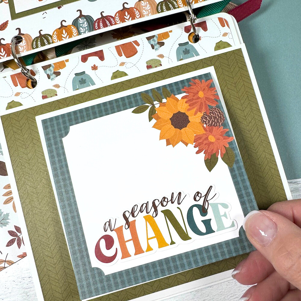 Sweater Weather Fall Scrapbook Album page with flowers, pinecones, sweaters, and a folding card