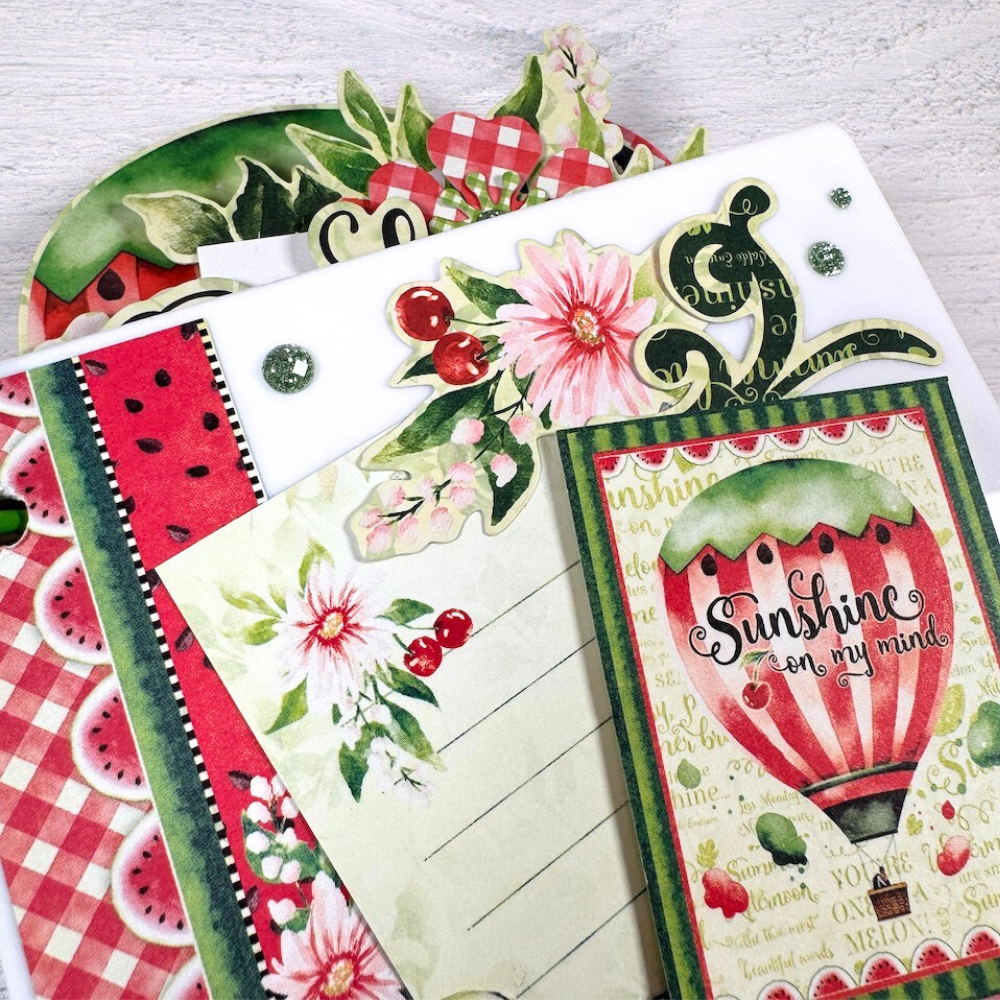 Pretty Summer Acrylic Scrapbook Album with a watermelon, hot air balloon, flowers, and glitter dots