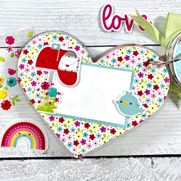 Lots of Love heart shaped acrylic mini album page with flowers, a mailbox, and a cute bird