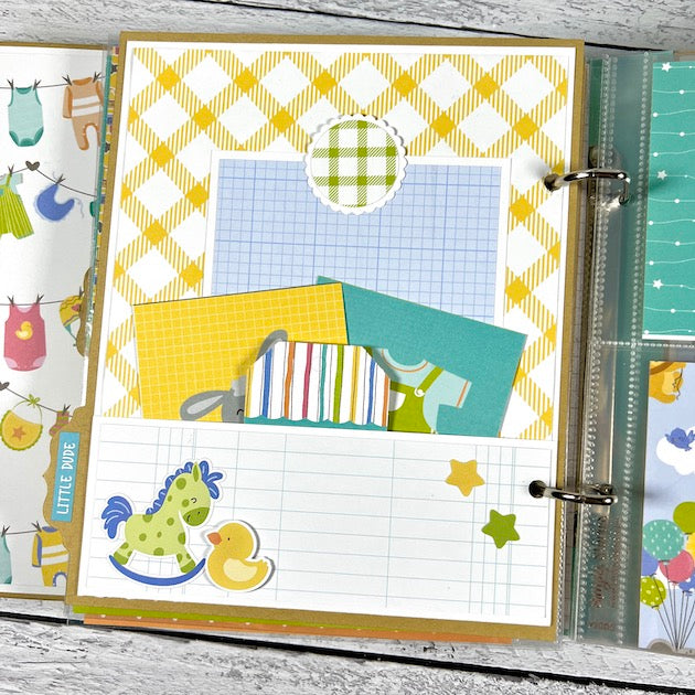 Baby Boy Scrapbook Album Page with a pocket, journaling cards, a rocking horse, and a duck