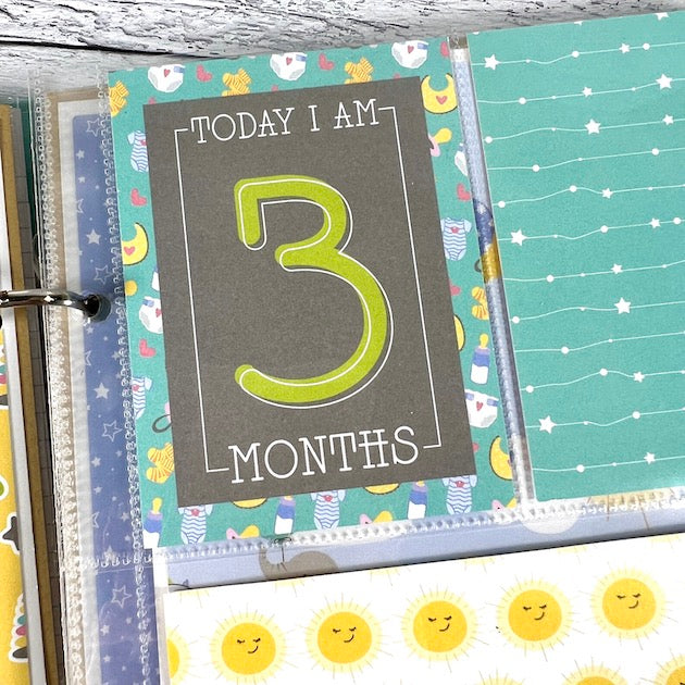 Baby Boy Scrapbook Album Page with monthly cards, cute baby items, and sunshine faces