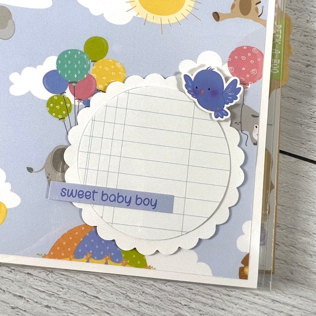 Baby Boy Scrapbook Album Page with an elephant, tiger, giraffe, balloons, and a little blue bird