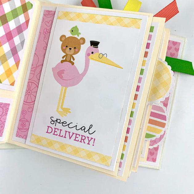 baby girl scrapbook mini album page with stork and baby bear