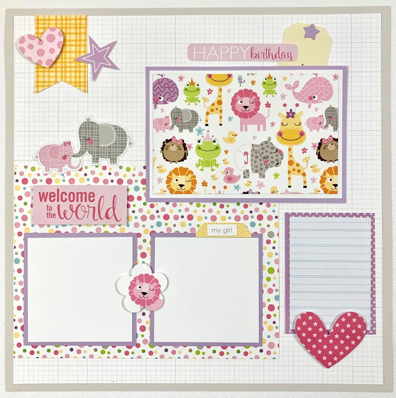 12x12 baby girl scrapbook layout with cute animals, polka dots, and a heart