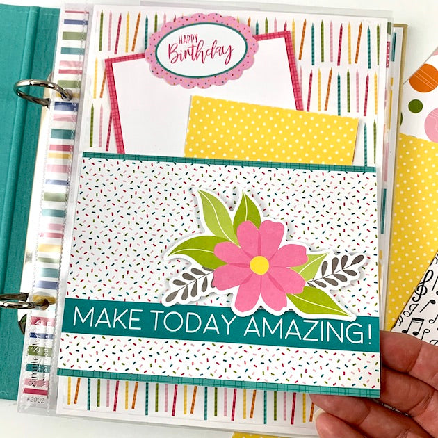 Birthday scrapbook album page with a pocket, journaling cards, and a pink flower