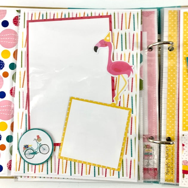 Birthday scrapbook album page with candles, a pink flamingo, and polka dots
