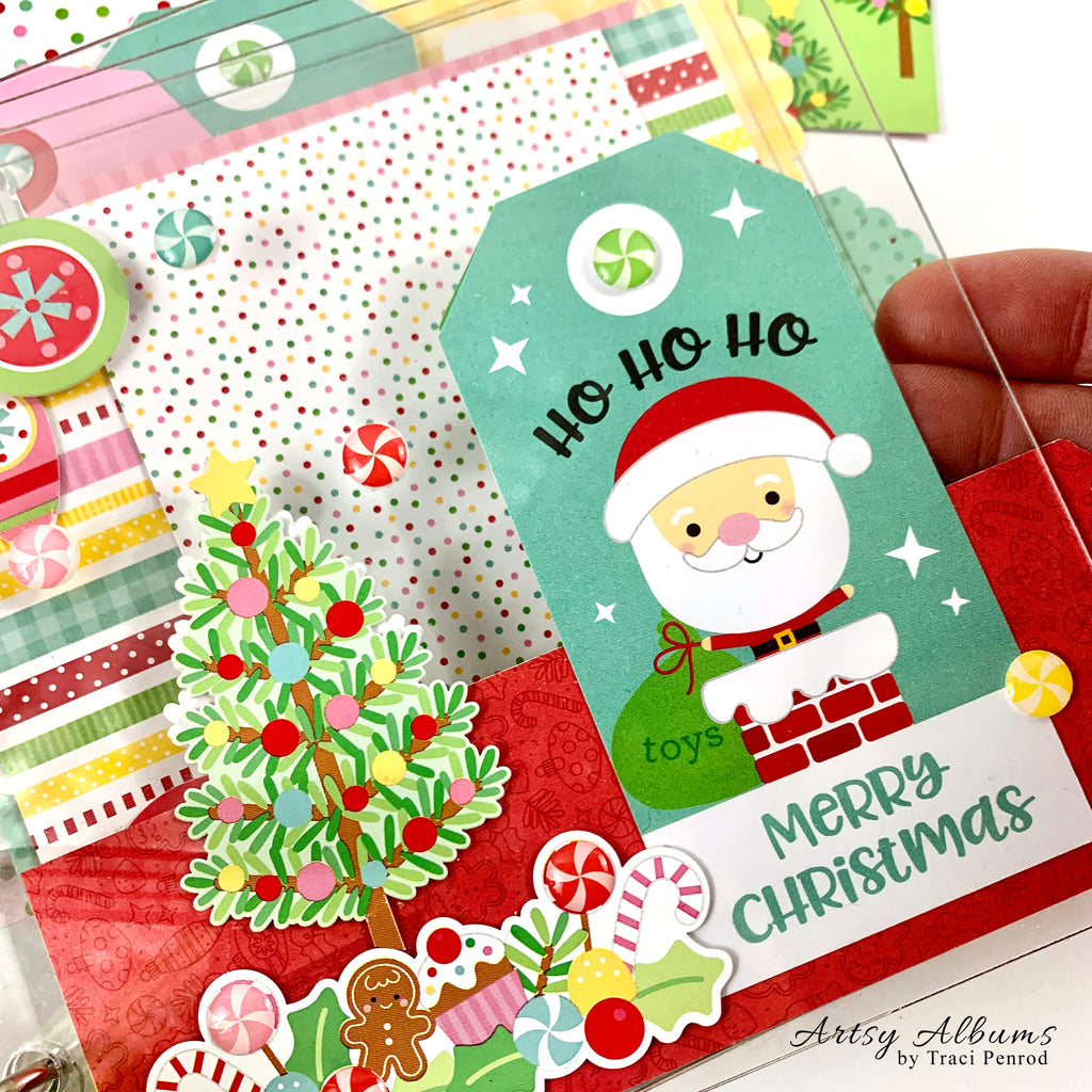 Clearly Christmas Scrapbook Mini Album with clear acrylic covers, Santa Claus, a Christmas tree, and sweet treats