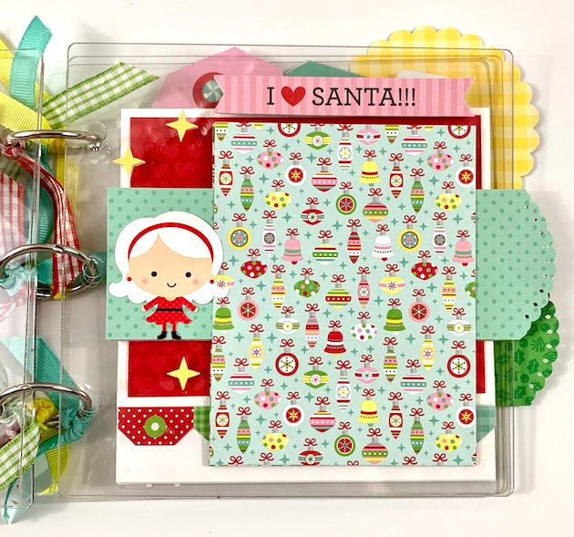 Clearly Christmas Scrapbook Mini Album page with a cute Mrs. Claus, stars, and ornaments