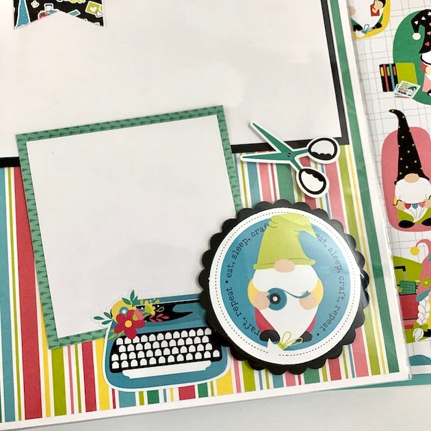 crafting scrapbook album page with gnome, scissors and typewriter