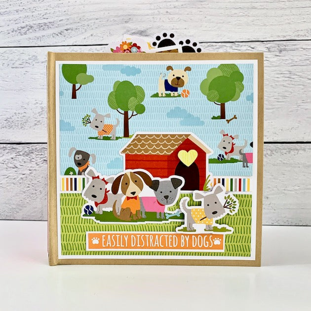 Easily Distracted By Dogs Scrapbook Album with cute pups, a doghouse, bones, and toys