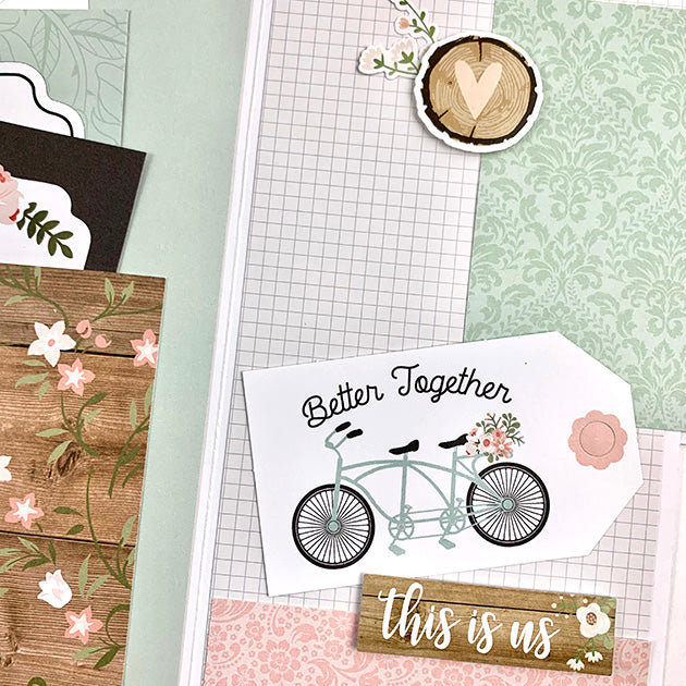 Our Wedding Day Scrapbook Album Page with lots of pretty flowers, a pocket, a bicycle, and woodgrain papers