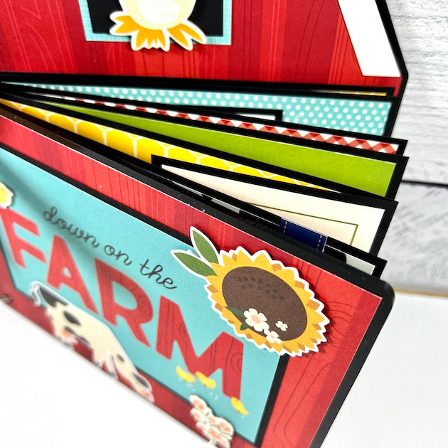 Farm Scrapbook Mini Album with animals, sunflowers, vegetables, a barn, and tractors