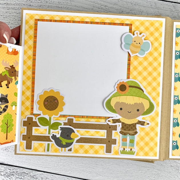 Fall Scrapbook Album Page with pretty warm colors, a scarecrow, & a sunflower