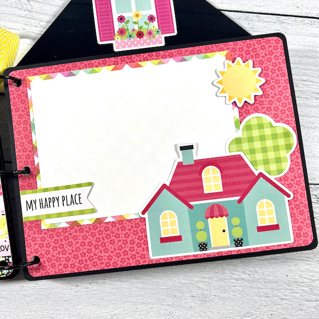 house shaped scrapbook album page with home and sun