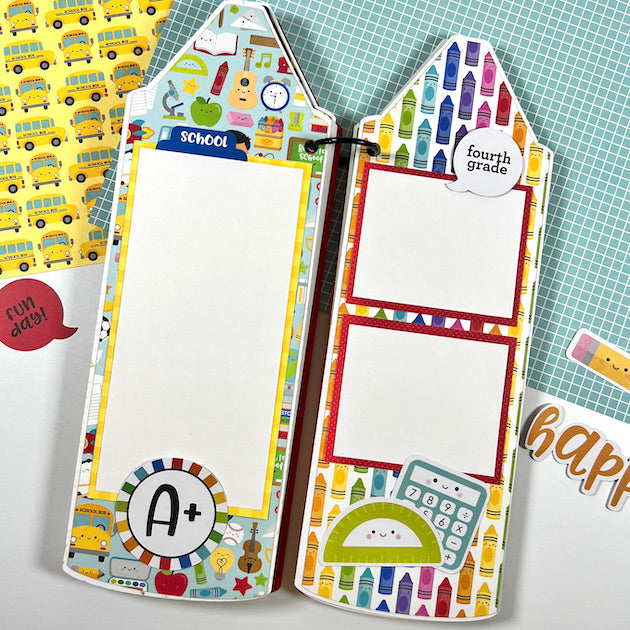Crayon shaped scrapbook album layouts with crayons and school supplies