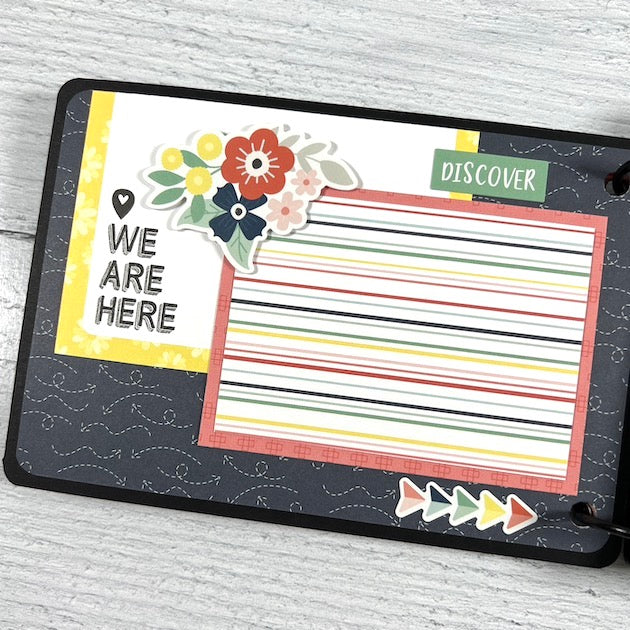 Camera shaped travel scrapbook album page with pretty flowers and colorful stripes