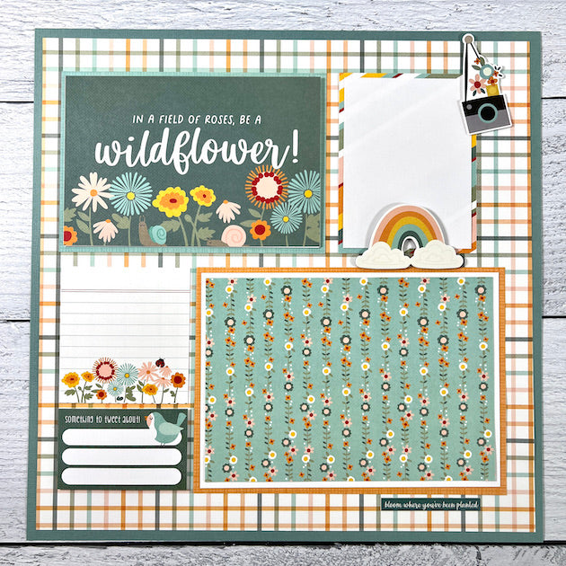 12x12 spring scrapbook layout with flowers, a rainbow, and a bird