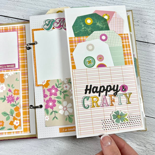 Creative Happy Girl Scrapbook album page with photo mats, flowers, plaid paper, a pockets, & tags