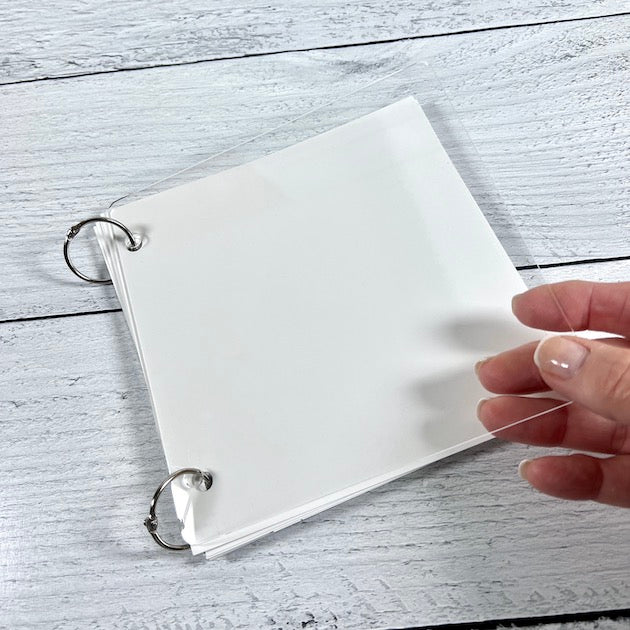 Clear Acrylic square scrapbook album with white cardstock pages