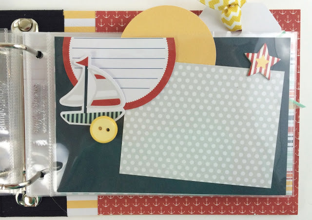 Under The Sun Scrapbook Album page with a sailboat, a button, star, ribbon, tags, and cute anchors
