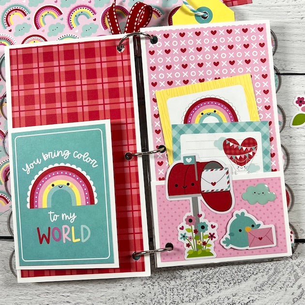 Valentine's Day Scrapbook Album Page with rainbows, a pocket, and journaling cards