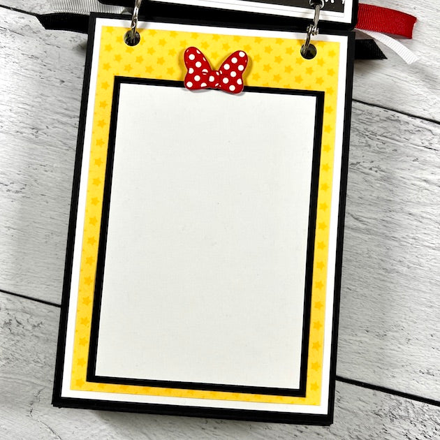 Disney themed scrapbook album page with stars and minne mouse bow