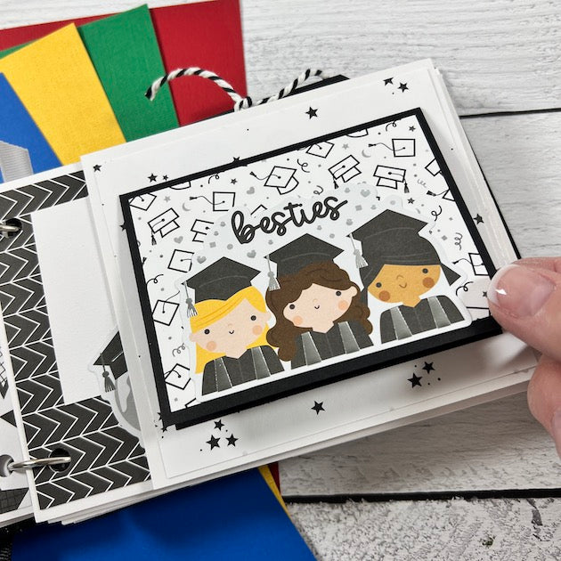 Graduation scrapbook mini album page with best friends wearing their cap and gown