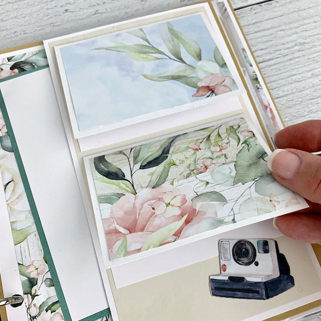Travel Scrapbook Page with flowers, a camera, & folding elements