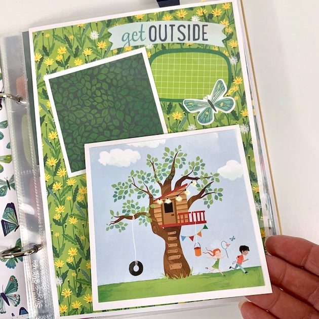 Never Grow Up Scrapbook Album page with a treehouse, daisies, and leaves