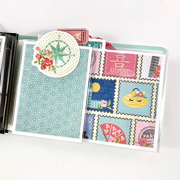 Travel Girl scrapbook album page with flowers & travel stamps