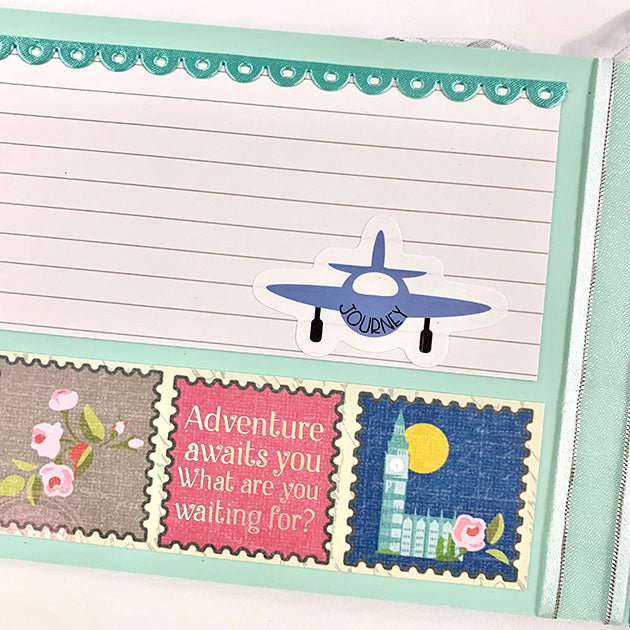 Travel Girl scrapbook album page with an airplane, a scalloped ribbon, and travel stamps