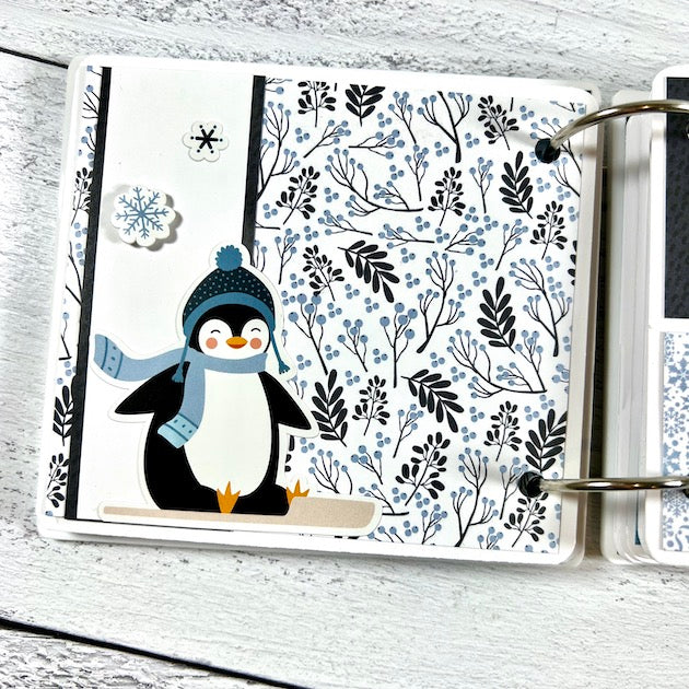 Winter Scrapbook Album page with penguin on a sled