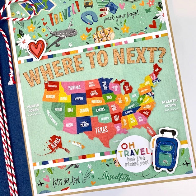 Where To Next Travel Scrapbook Album with a map, vibrant colors, and travel accessories