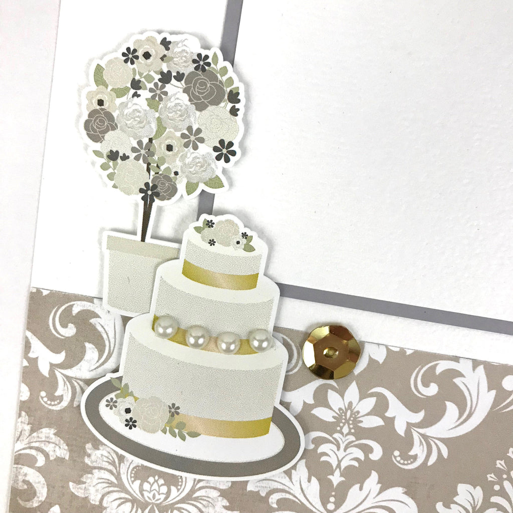 12x12 wedding scrapbook Page Layout with a cake, gold sequins, and pearls